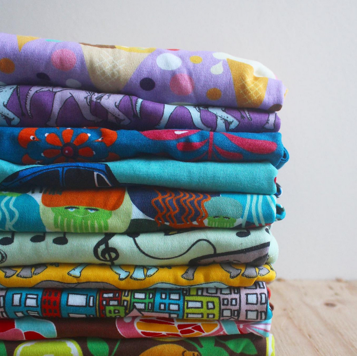 Stack of printed clothing from Hoopla Kids